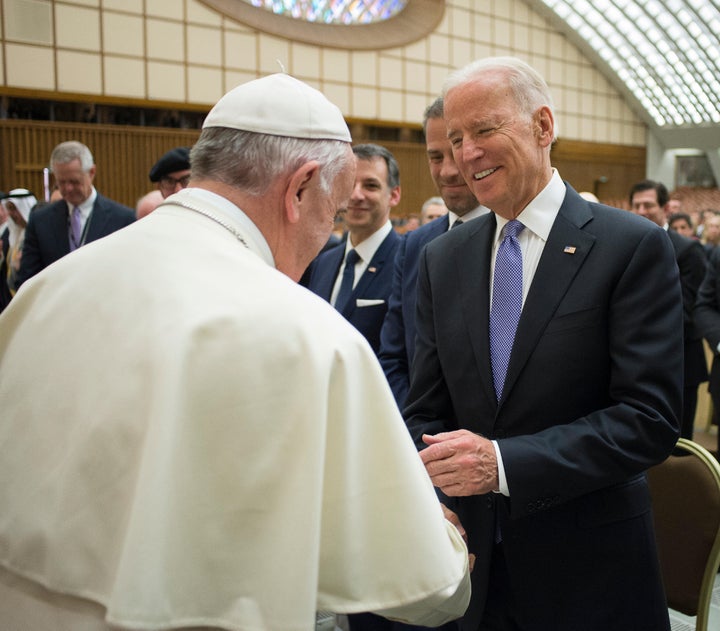 Pope Francis shakes hands with then-Vice President Joe Biden in the Pope Paul VI hall at the Vatican, April 29, 2016.