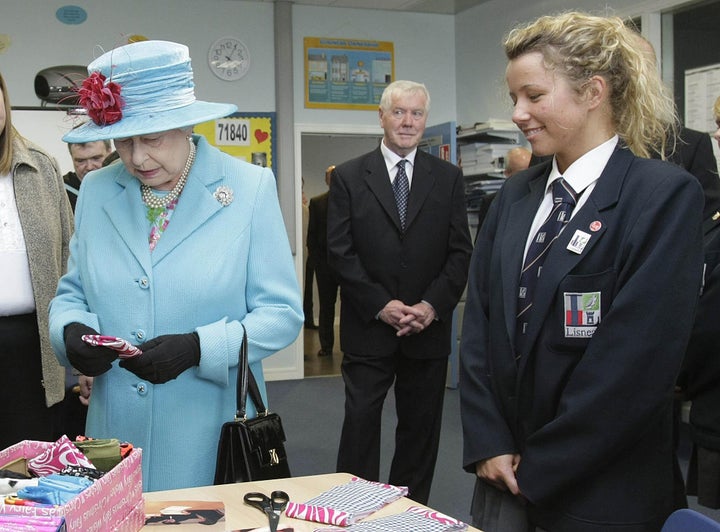 Queen Elizabeth being given a protective cover for her iPod during a visit to Northen Ireland in 2009.