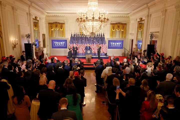 Trump speaks on election night in a packed White House East Room, where few guests wore masks. 
