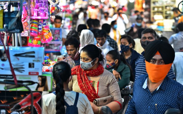 NEW DELHI, INDIA NOVEMBER 10: People shop at Ghadi Market for the upcoming festive season, at Chandni Chowk, on November 10, 2020 in New Delhi, India. (Photo by Raj K Raj/Hindustan Times via Getty Images)