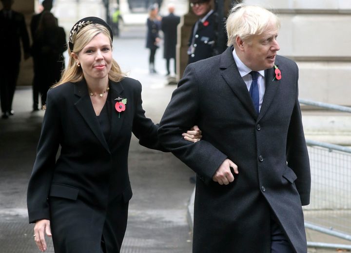 Prime Minister Boris Johnson, right, with partner Carrie Symonds,