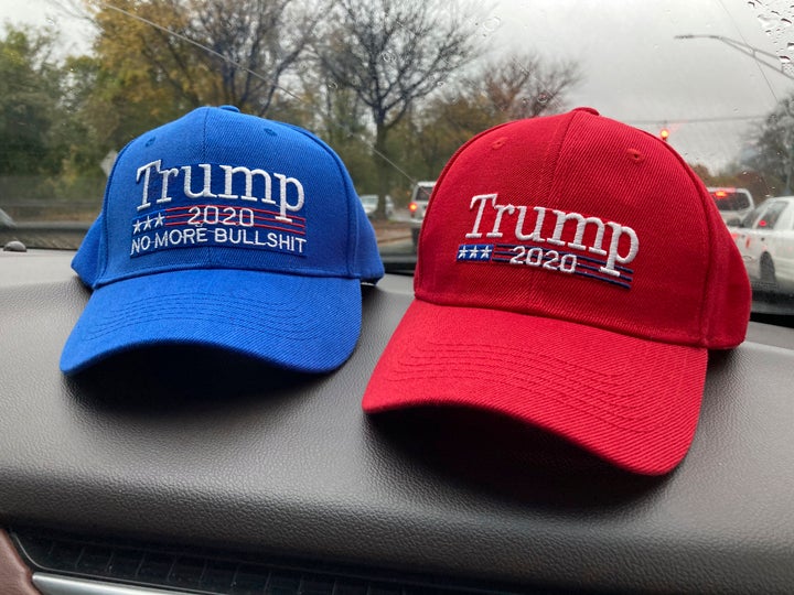 Two pro-Trump hats sit on top of a car dashboard in Nyack, New York, on Nov. 1.