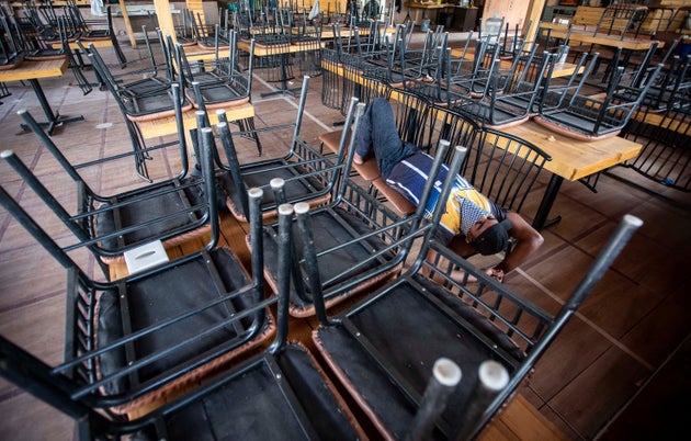 A shut restaurant near Mhatre bridge in Pune on 26 March. Restaurant staff, airline staff, tour...
