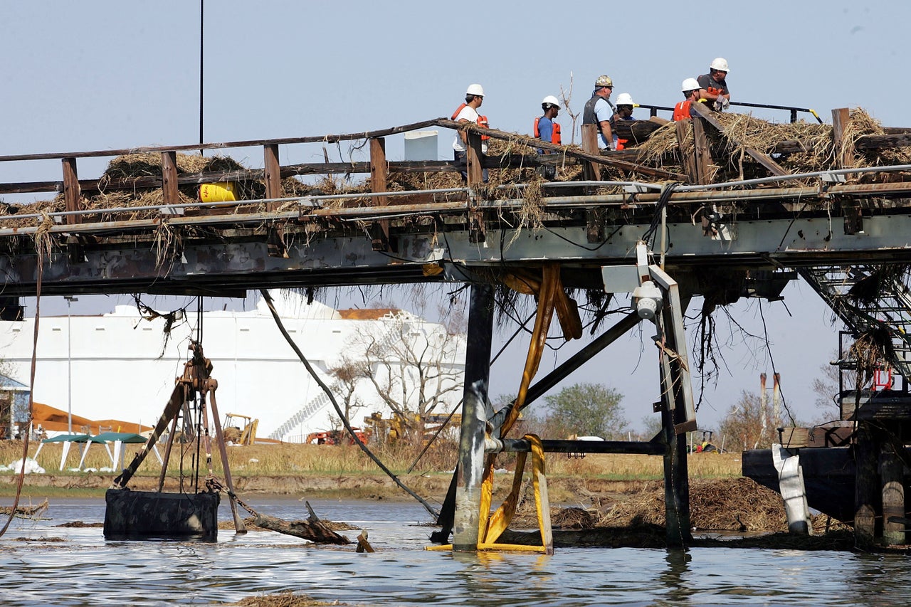 Workers repair a pipeline from a Chevron Texaco facility on Sept. 11, 2005, after it was damaged by Hurricane Katrina. Credit: Joe Raedle/Getty Images