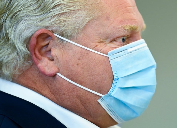 Ontario Premier Doug Ford speaks with health workers at Humber River Hospital in Toronto on Nov. 5, 2020. 