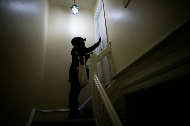 A volunteer knocks on doors for Joe Biden in Landsdowne, Pennsylvania. Critics believe that the party adopted traditional field tactics like canvassing too late to match Republican efforts.