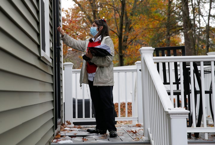 A volunteer knocks doors for President Donald Trump in Nashua, New Hampshire. The Republican National Committee modeled its field program on Barack Obama's 2012 effort.