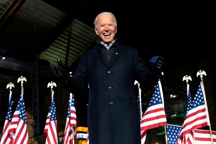 President-elect Joe Biden gestures speaks at a drive-in rally in Pittsburgh on the eve of Election Day. He was more cautious about in-person campaigning than President Donald Trump.