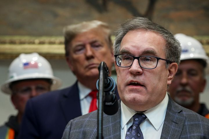 President Donald Trump looks on as Environmental Protection Agency Administrator Andrew Wheeler speaks at an event at the Whi