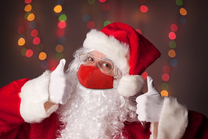 Santa Claus gives two thumbs up, assumedly to the idea of celebrating Christmas safely this year. 