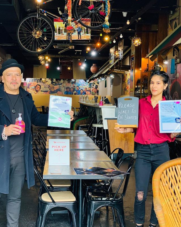 Desi Dhaba restaurant owner Amit Tuteja, pictured at left with one of his staff members, said Diwali will be different this year, with only 40 people allowed to dine at a time.