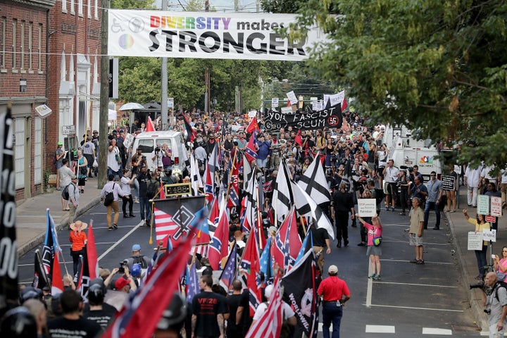 White nationalists, neo-Nazis and members of the "alt-right" march through Charlottesville, Va., during the "Unite the Right" rally Aug. 12, 2017.