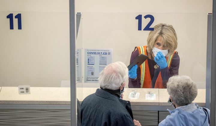 Staff were on hand to guide and help people through the new saliva COVID-19 testing site at the Minneapolis-St. Paul International Airport, Nov. 12.