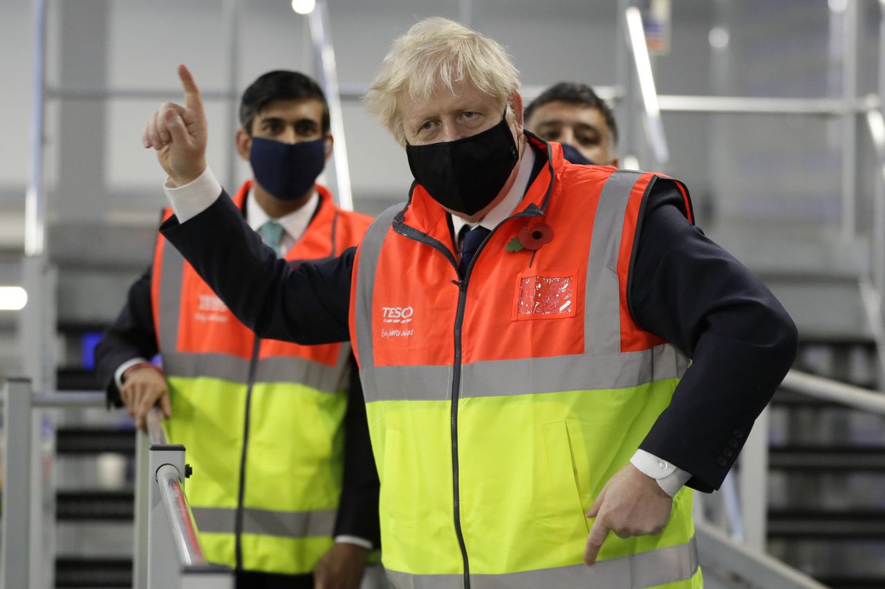 Boris Johnson alongside chancellor Rishi Sunak during a visit to the Tesco Erith distribution centre in south east London.