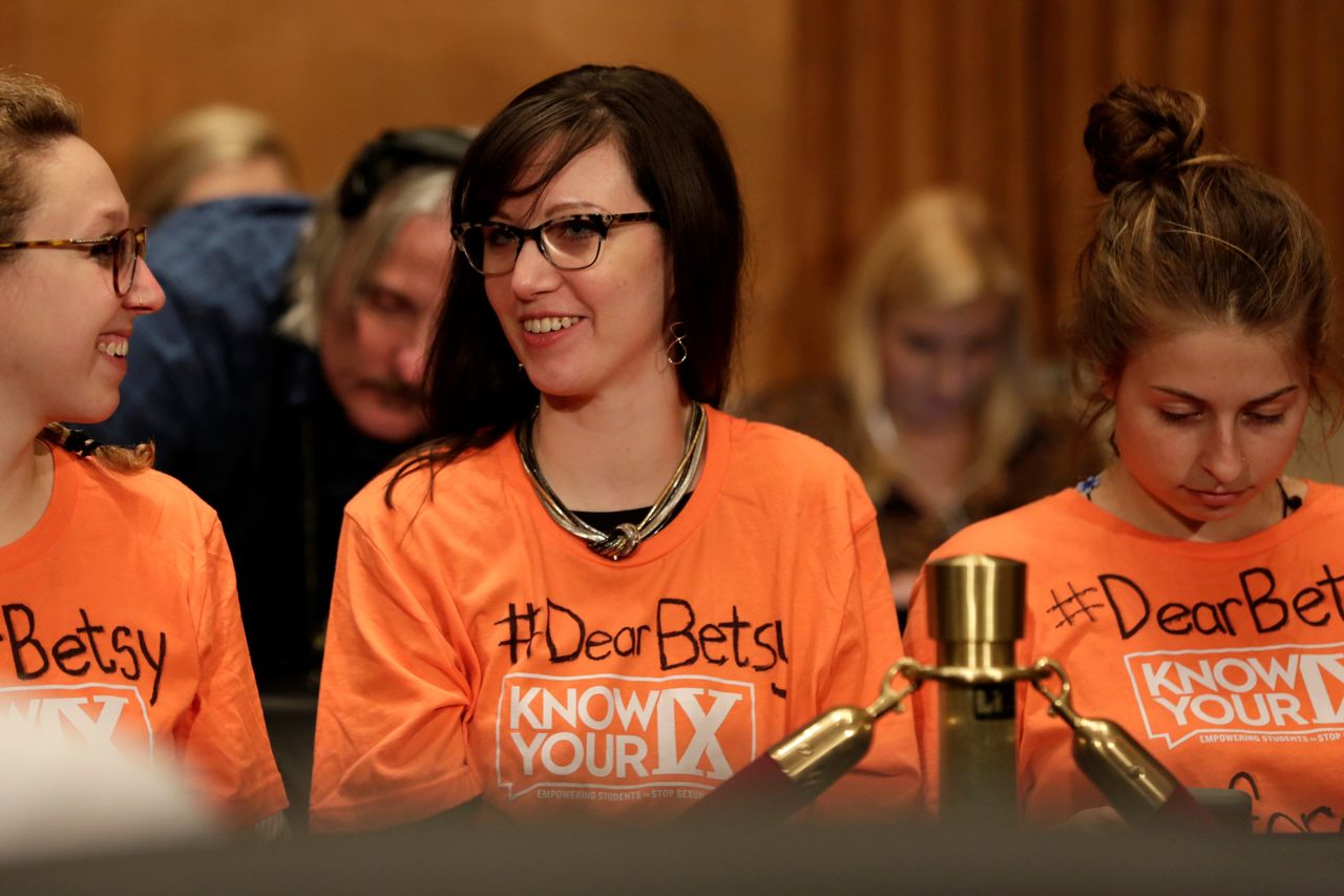 Members of the audience wait for the start of DeVos' confirmation hearing to be secretary of education in 2017. The #DearBetsy hashtag was part of a campaign urging DeVos to protect campus sexual assault guidelines laid out by Title IX.