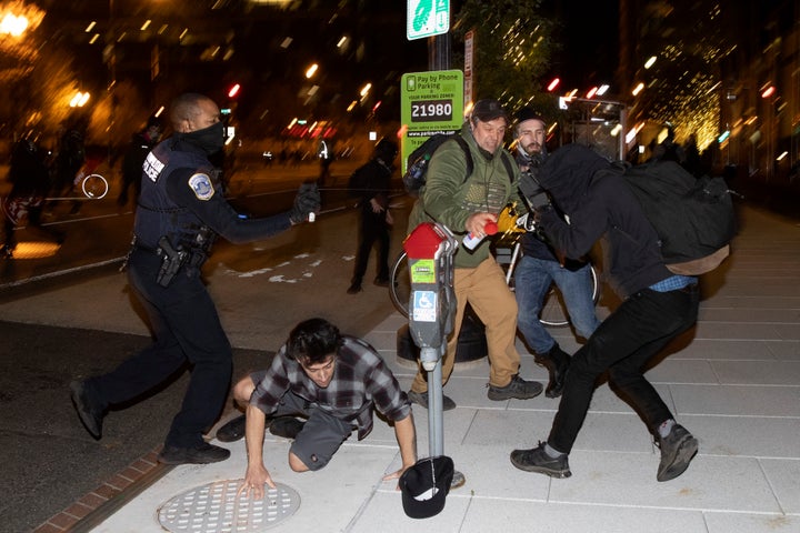 Members of the Proud Boys clash with Black Lives Matter protesters during a protest following the “Million MAGA March” from Freedom Plaza to the Supreme Court, on November 14, 2020 in Washington, DC. Supporters of U.S. President Donald Trump gathered to protest the outcome of the 2020 presidential election. (Photo by Tasos Katopodis/Getty Images)