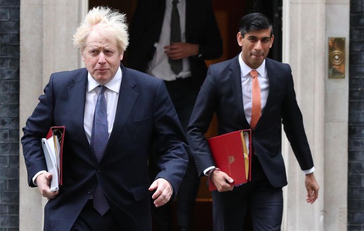 Prime minister Boris Johnson and chancellor Rishi Sunak leave 10 Downing Street.