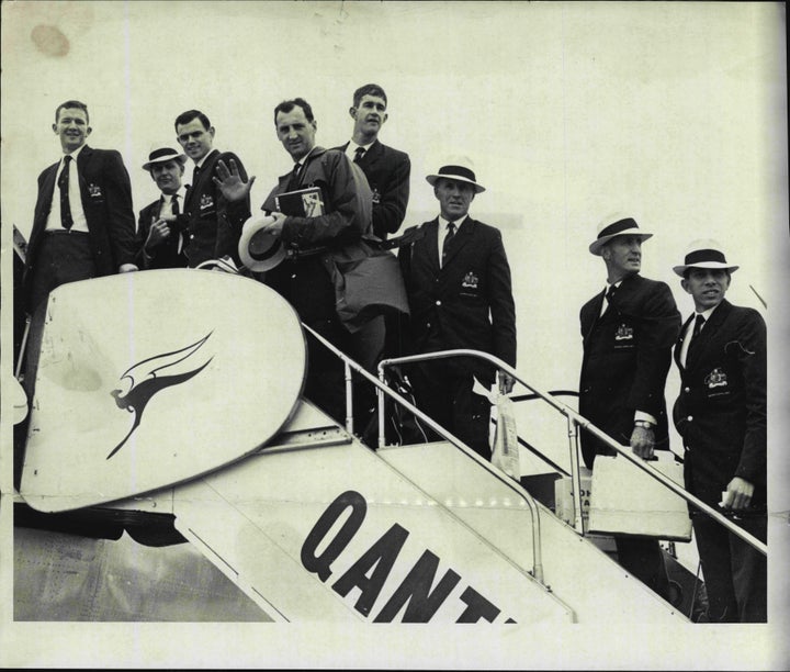 The Australian Basketball Olympic team at Mascot today board their Qantas plane for Hong Kong. September 11, 1964. 