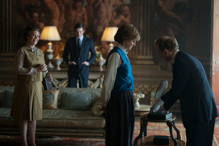 Emma on set with co-stars Olivia Colman and Josh O'Connor