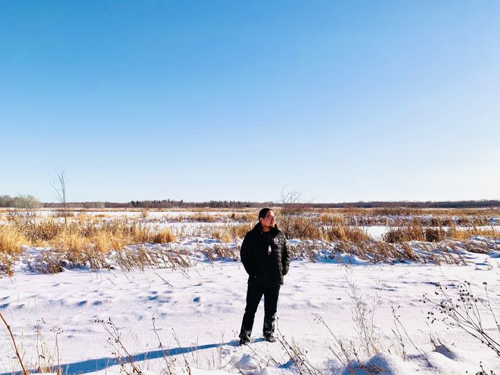 Enoch Cree Nation Chief Billy Morin standing in front of Yekau Lake, the former location of a federal bomb practice range.