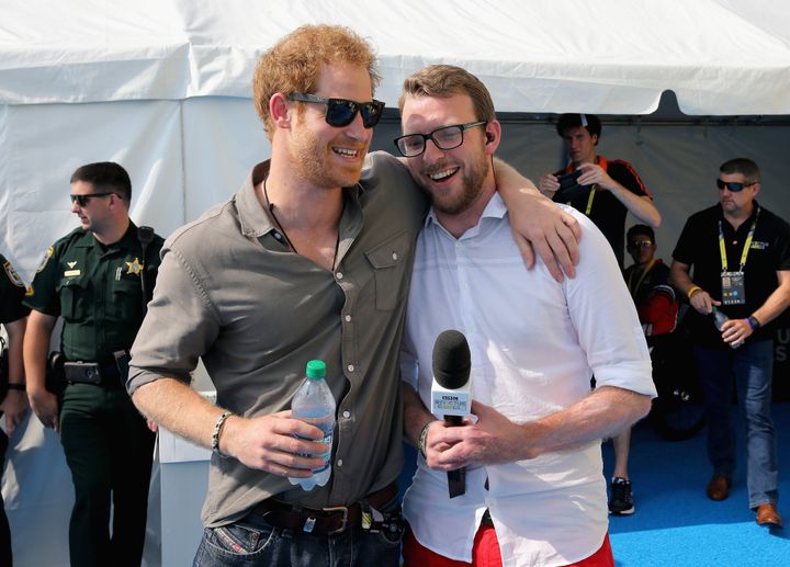Prince Harry chats with former competitor and now commentator JJ Chalmers outside the competitor's tent during the 2016 Invictus Games in Orlando, Florida.