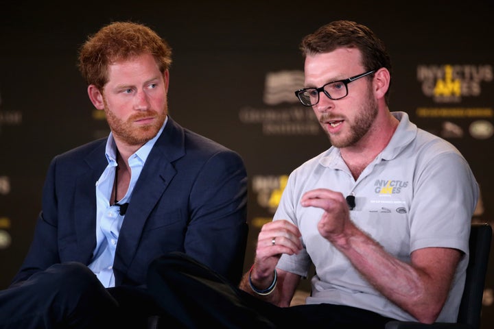 Harry and Chalmers talk at a symposium on invisible wounds on May 8, 2016, in Orlando.