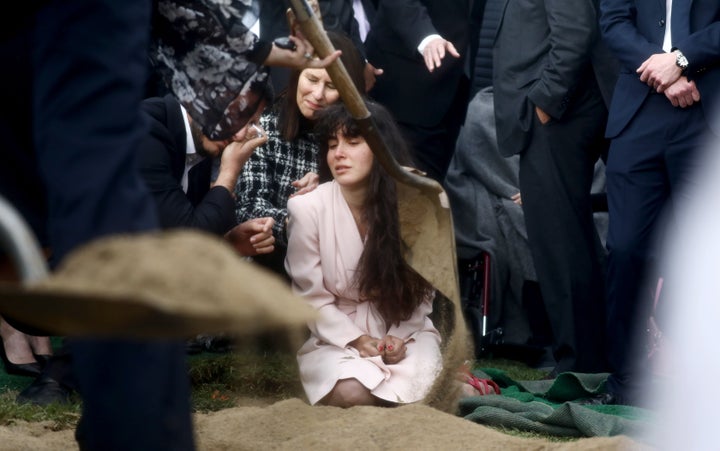 Lori Gilbert Kaye's daughter mourns at her mother's grave on April 29, 2019, in San Diego, California. Kaye was killed in the Poway synagogue shooting.