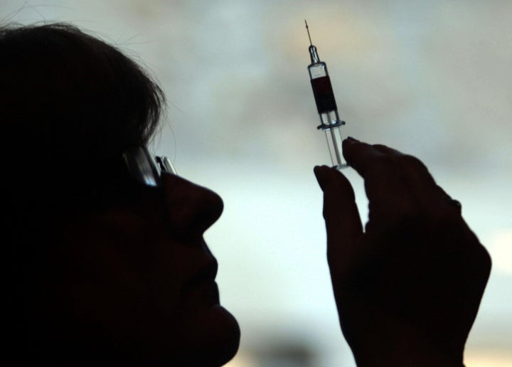 File photo of a nurse preparing to give a patient a vaccine