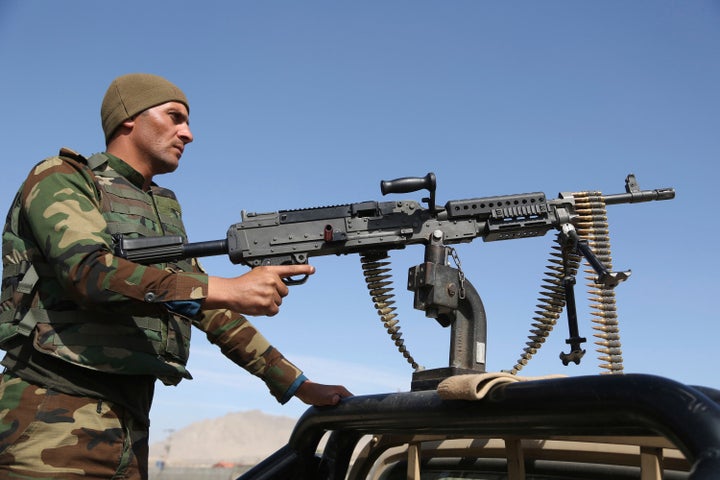 In this Oct. 17, 2018, photo, Afghan National Army soldiers stand guard at a checkpoint in Kabul, Afghanistan. 