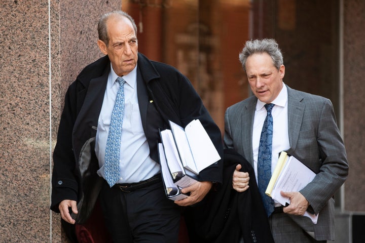 Victims attorneys Paul Mones, left, and Michael Pfau, depart during a recess in the Boy Scouts of America's bankruptcy hearing in Wilmington, De., Wednesday, Feb. 19, 2020. (AP Photo/Matt Rourke)