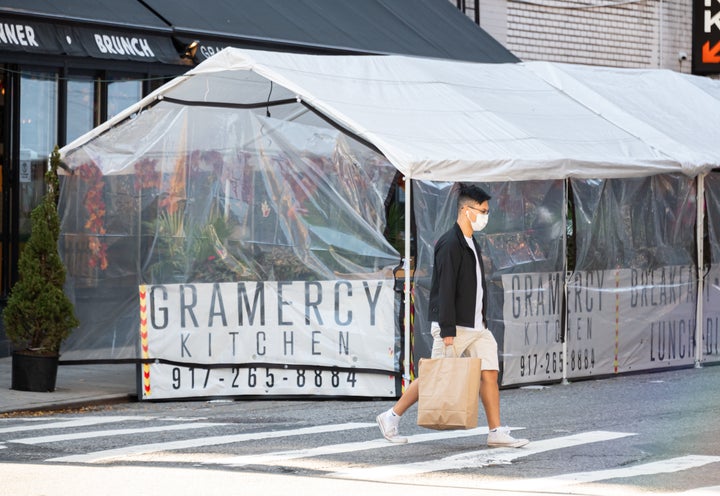 An outdoor tented restaurant area in New York City. 