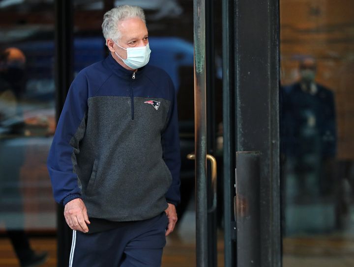 Former Harvard University fencing coach Peter Brand leaves a Boston courthouse on Monday after being arraigned and freed on bail.