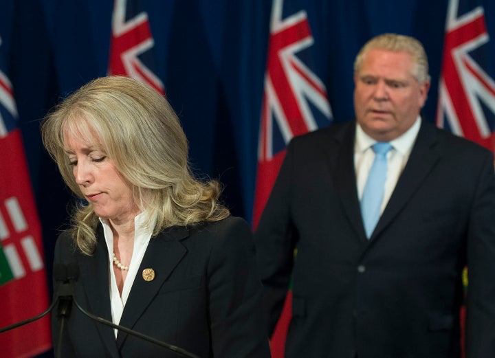 Ontario Minister of Long-Term Care Merrilee Fullerton answers questions with Premier Doug Ford at Queen's Park in Toronto on May 26, 2020.