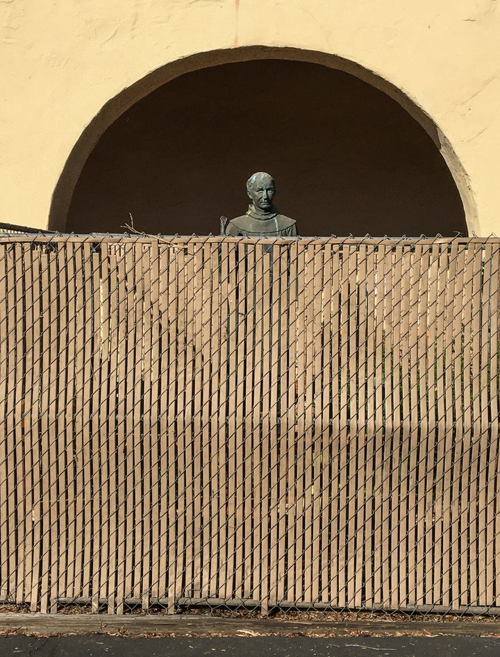 A bronze statue of St. Junípero Serra, located at the entrance to the Old Mission Santa Ines in Solvang, California, i