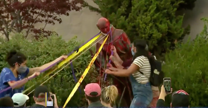 Protesters pull down a statue of St. Junípero Serra at Mission San Rafael Arcángel in San Rafael, California, o
