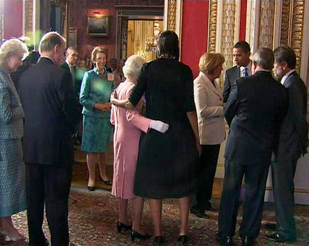 A video grab from television footage shows Michelle Obama hugging Queen Elizabeth during a reception for G20 leaders at Buckingham Palace in London April 1, 2009. 