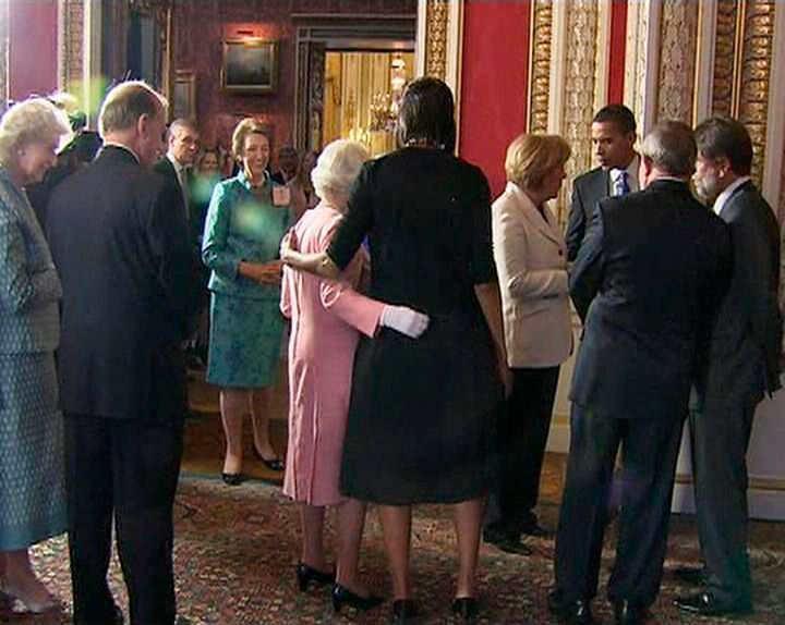 A video grab from television footage shows Michelle Obama hugging Queen Elizabeth during a reception for G20 leaders at Buckingham Palace in London April 1, 2009. 