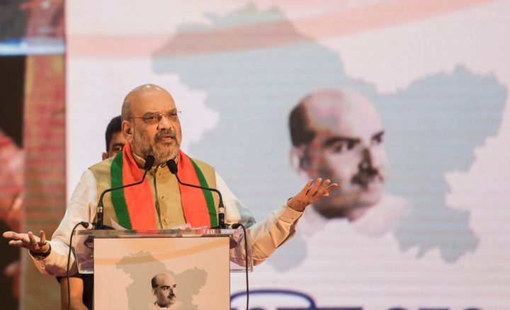 Home minister Amit Shah speaking at a seminar about the repeal of Article 370 with an image of Shyama Prasad Mukherjee on the map of Jammu and Kashmir behind him in this file photo. As Home Minister, Shah implemented the Narendra Modi government's decision of repealing Article 370.