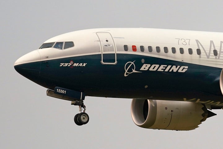 FILE - In this Sept. 30, 2020, file photo, a Boeing 737 Max jet, piloted by Federal Aviation Administration Chief Steve Dickson, prepares to land at Boeing Field following a test flight in Seattle. The FAA is poised to clear the Boeing 737 Max to fly again after grounding the jets for nearly two years due to a pair of disastrous crashes that killed 346 people. (AP Photo/Elaine Thompson, File)