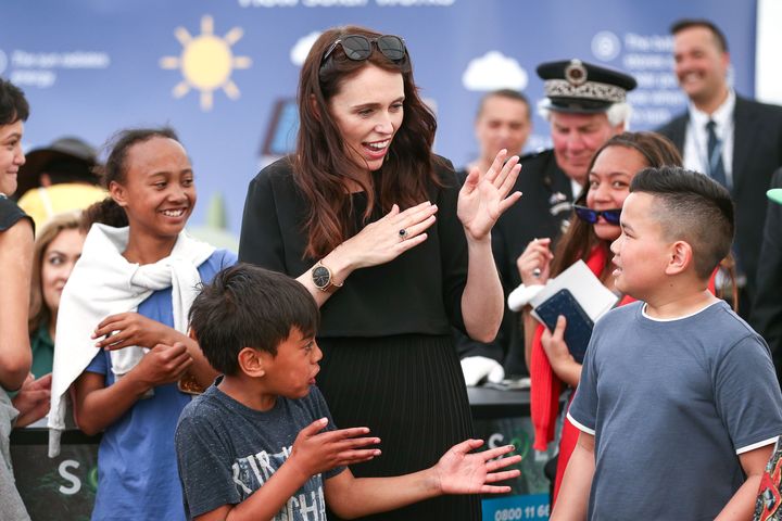 New Zealand Prime Minister Jacinda Ardern plays a game with children during celebrations in Ratana, New Zealand, in November 2018. Ardern's new "well-being budget" has children's well-being as one of its priorities. Credit: Hagen Hopkins/Getty Images