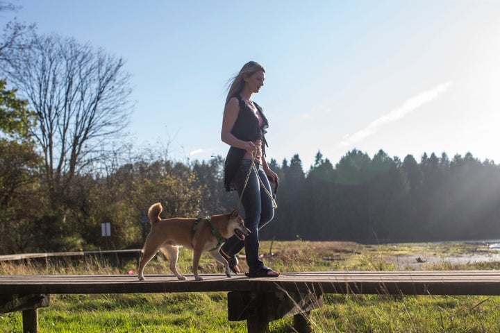 Juli-Ann Aaron walks with her dog Pumpkin near her home in Port Moody, B.C.