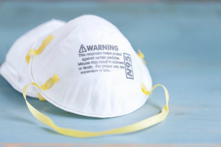 An N95 mask is shown in a stock photo.