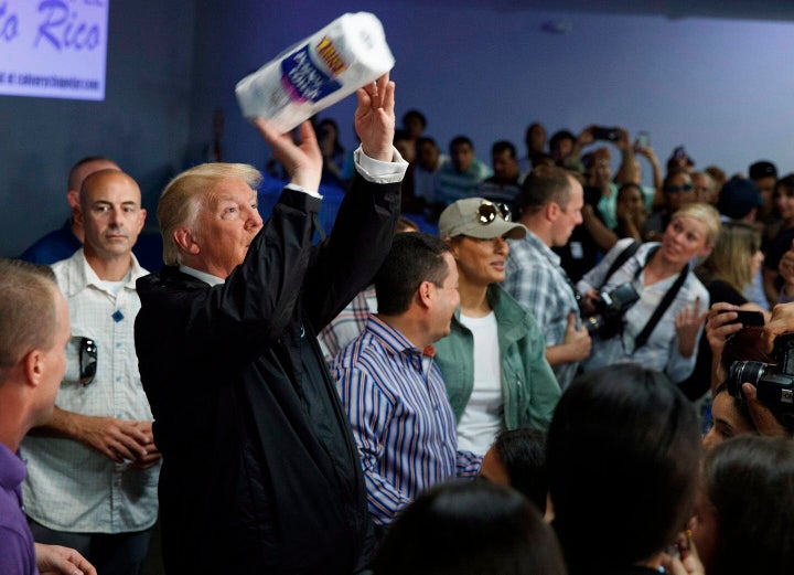 On Oct. 3, 2017, U.S. President Donald Trump tosses paper towels into a crowd in Guaynabo, Puerto Rico, after Hurricane Maria devastated the region. 