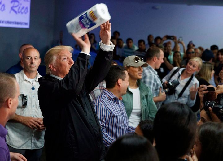 On Oct. 3, 2017, U.S. President Donald Trump tosses paper towels into a crowd in Guaynabo, Puerto Rico, after Hurricane Maria devastated the region. 