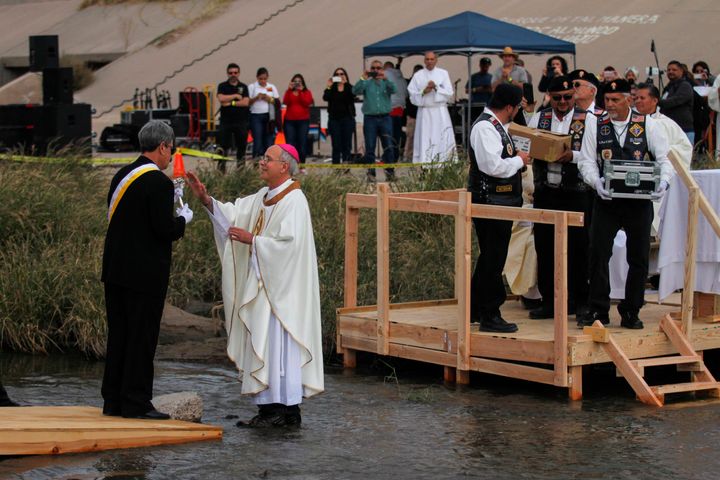The Catholic bishop of El Paso, Texas, Mark Seitz (center), participates in a binational mass attended by hundreds of Mexican and US Catholics across the border, held in memory of migrants killed by crossing the Rio Bravo in their attempt to reach the United States in Ciudad Juarez, Chihuahua state, Mexico on November 4, 2017. 