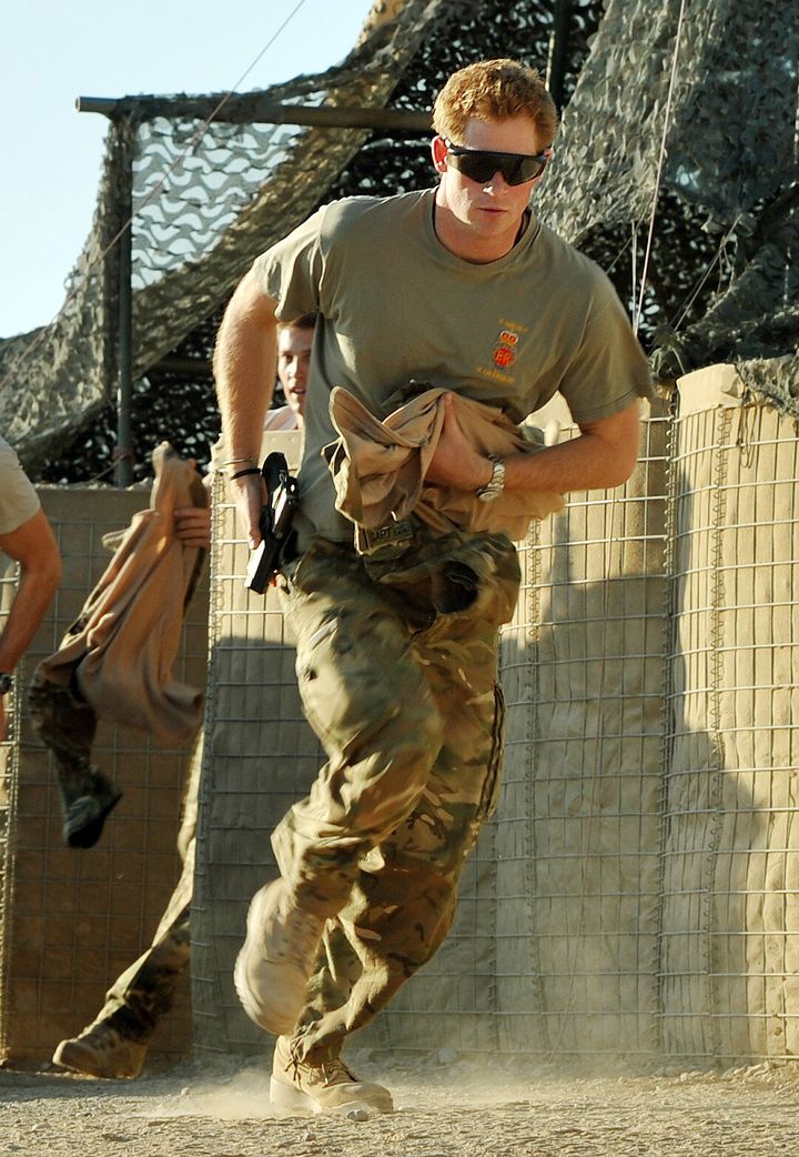 Prince Harry races out from the VHR (very high ready-ness) tent to scramble his Apache helicopter with fellow pilots, during his 12-hour shift at the British-controlled flight-line in Camp Bastion, Afghanistan, on Nov. 3, 2012.