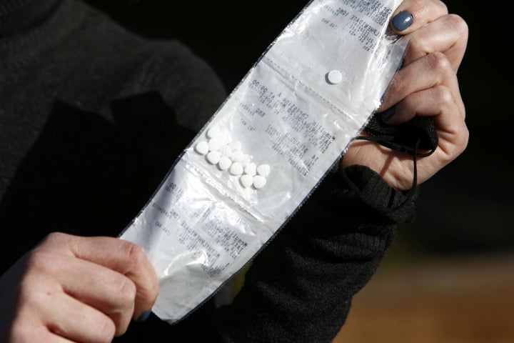 Chrissy McMullin displays her "safe supply" of opioid alternative Dilaudid, provided by the local health unit to combat overdoses due to poisonous additives and to support addicts and the homeless into practicing social distancing to help slow the spread of COVID-19 in Vancouver. 