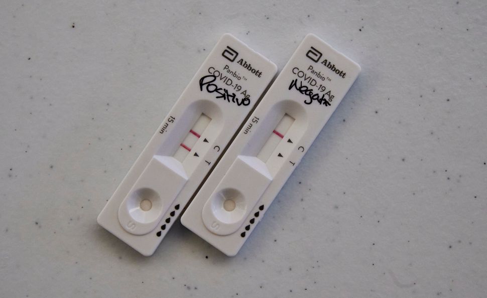  Abbott Panbio test sticks show "positive" and "negative" results at the drive-thru area in the new Portuguese Red Cross COVID-19 Testing Post in Lar Militar during the COVID-19 pandemic on Oct. 16, 2020 in Lisbon.
