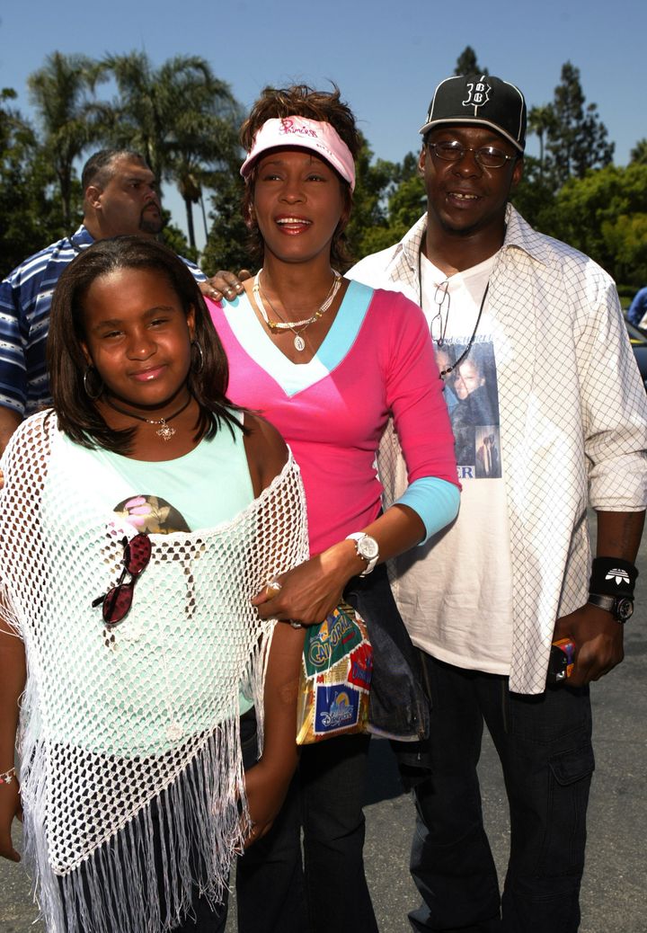 Whitney Houston (center), daughter Bobbi Kristina and Bobby Brown