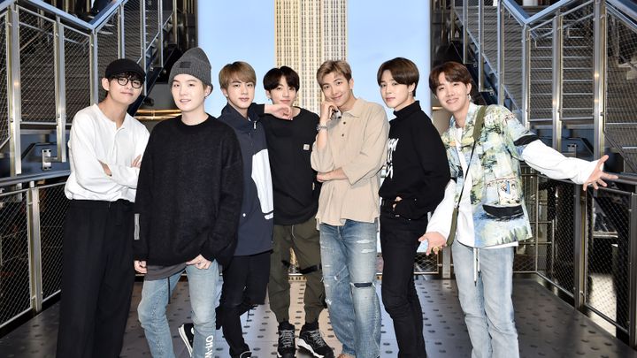 (left to right) V, Suga, Jin, Jungkook, RM, Jimin, and J-Hope from BTS visit The Empire State Building on May 21, 2019.